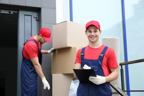 Professional movers carefully packing items in Storage Balham